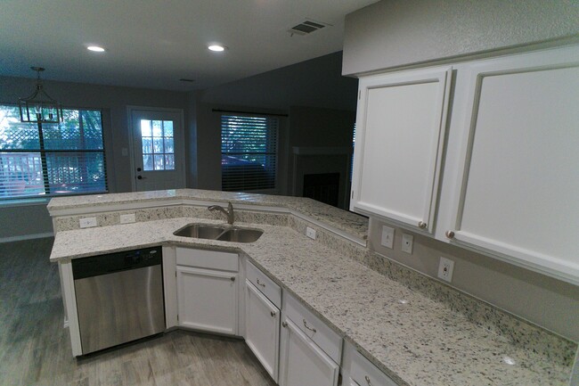 Kitchen with Granite and Stainless Appliances - 12905 Modena Trail