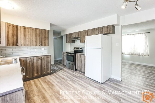 Building Photo - Spacious, Updated Pet Friendly Half Duplex with Fenced Yard!