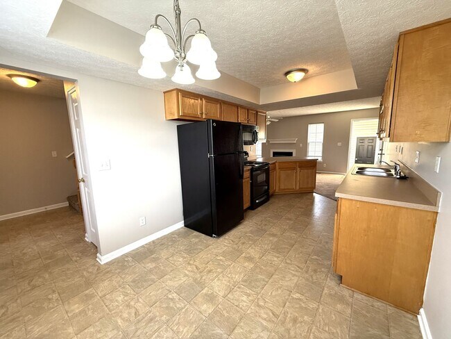 Building Photo - LARGE 2 Bedroom 2 1/2 Bath Townhome with Full Finished Basement and 1 Car Garage