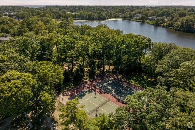 Challenge a neighbor to a tennis match at nearby Brookwood Hall Park on the border of Islip.