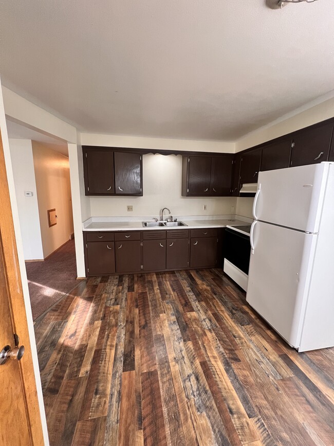 Updated painted cabinets and LVP flooring - 5712 N 97th St