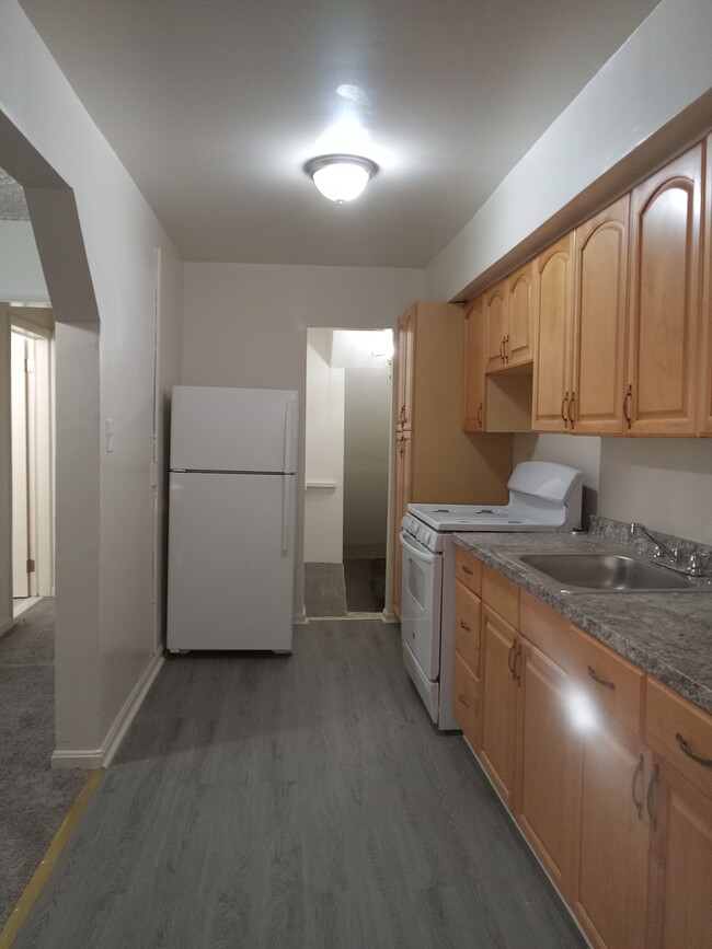 Kitchen. Steps lead to lower level - 2982 Sollers Point Rd