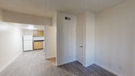 Located at 3230 East Roosevelt Street in Phoenix, AZ, this one-bedroom, one-bathroom unit offers a practical and efficient single-floor layout. The interior features wood-look laminate flooring throughout, crisp white walls, and textured ceilings that give the space a clean, consistent aesthetic.

The living room serves as the central gathering area, with a front entry door and a window fitted with vertical blinds that allow for natural light and privacy. The open feel of the space makes it easy to arrange furnishings to suit various needs.

The kitchen is well-equipped with warm honey-toned wood cabinetry, dark granite-style countertops, a white electric range, a full-size refrigerator, and a stainless steel sink — all set on light laminate flooring with ceiling-mounted lighting.

The bedroom is a comfortable, private space with its own window for natural light and direct access to a closet. The room provides ample flexibility for bedroom furniture arrangements.

The bathroom includes a full tub-shower combination, a toilet, and a vanity with wood cabinetry topped with a dark granite-style countertop and a large mirror. A hallway connects the main rooms, providing a logical and convenient flow throughout the unit.