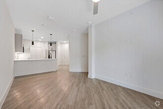 1BR, 1BA - 717SF - Living Room - Aura Main Street