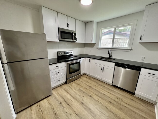 Updated Kitchen with stainless steel appliances. - 3309 Mays St