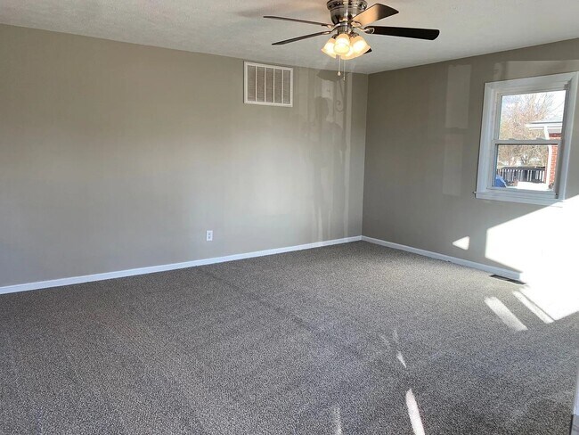 Building Photo - Charming Updated Home with Flexible Layout, Large Garage, and Modern Upgrades