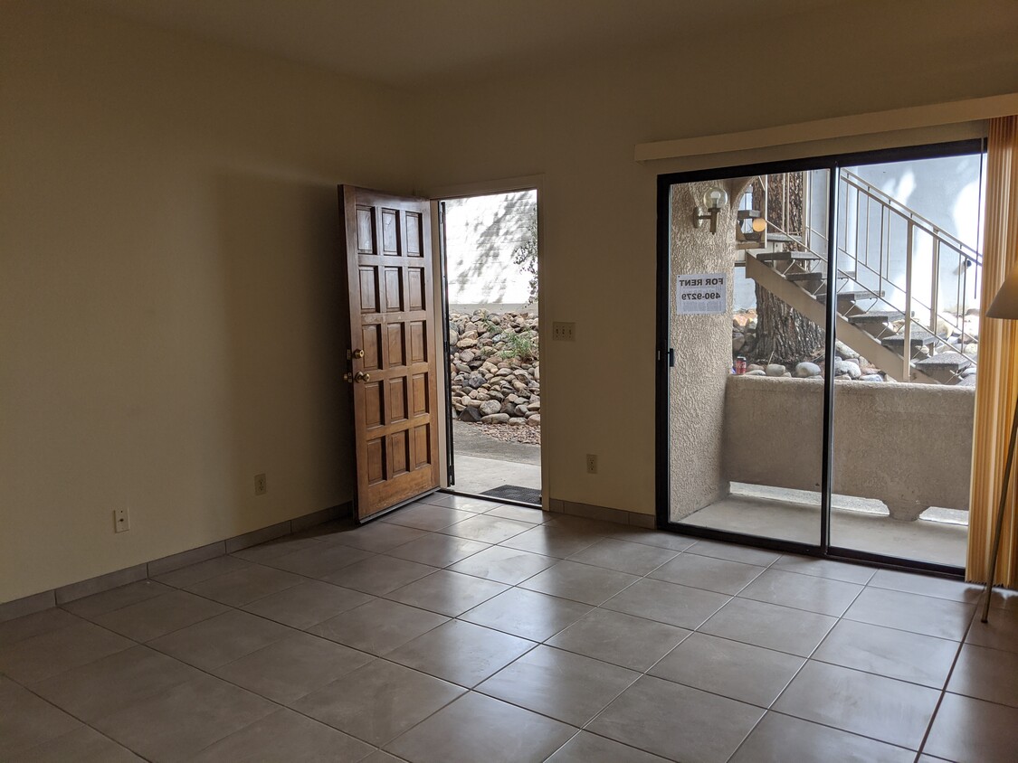 Living room with sliding door out to small patio. - 5750 N Camino Esplendora