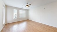 Located at 1300 Hendricks Ave in Jacksonville, FL, this single-floor residence offers a thoughtfully designed layout that maximizes both comfort and functionality. The open-concept kitchen and living area serves as the heart of the home, featuring warm hardwood-style flooring that flows throughout the main living spaces. The kitchen is outfitted with crisp white shaker cabinetry, granite countertops, a large central island with a built-in sink, stainless steel appliances including a refrigerator, range, microwave, and dishwasher, and stylish pendant lighting that adds a modern touch. Recessed lighting further brightens the space, creating a clean and inviting atmosphere. The living area is generously proportioned with natural light filtering in through windows fitted with slatted blinds. The bedroom offers plush carpeting underfoot, a ceiling fan with light fixture, and multiple windows that bring in ample daylight while providing views of the surrounding area. The neutral, light-toned walls throughout create a calm and versatile backdrop. A private balcony extends the living space outdoors, ideal for enjoying the Florida climate. This residence combines practical design with quality finishes in a convenient Jacksonville location.