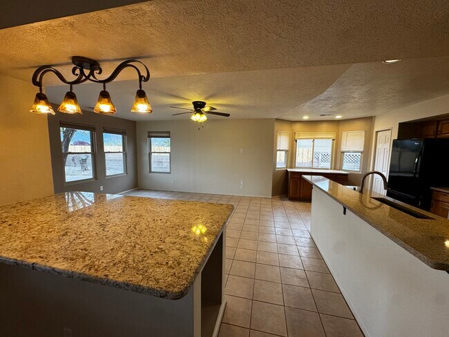 Island separates LR and Kitchen/Dining - 2598 Withington Peak Dr NE