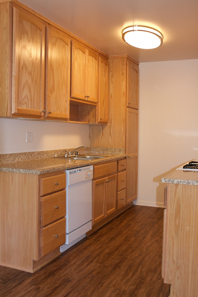 kitchen w/built-in dishwasher - Newcastle Towers Apartments