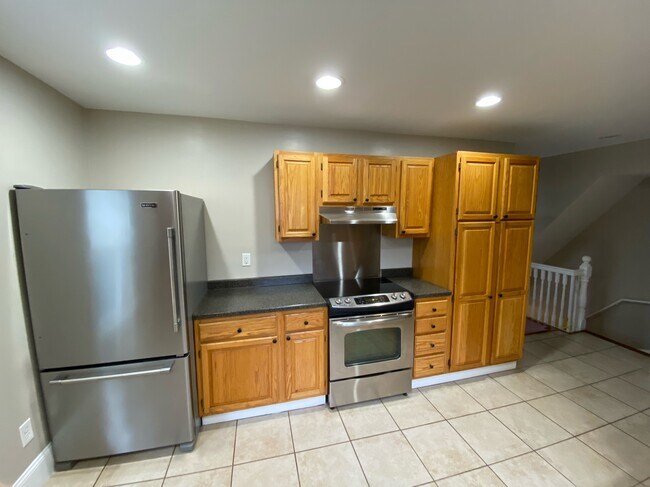 Large kitchen with newly upgraded stainless steel appliances and large pantry cabinet - 72 Spring St