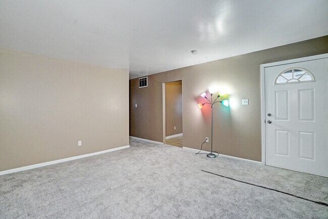 Living Room looking into hall and kitchen - 2321 S Hunter Rd