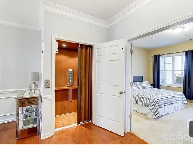 Elevator next to master bedroom on main floor with a full bath - 112 Inlet Point Dr