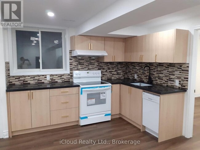 Building Photo - 6607 Song Bird Crescent