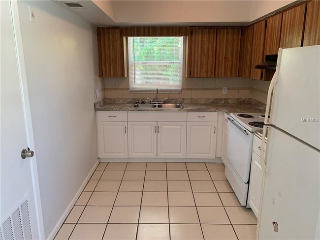 Building Photo - 7108 S Kissimmee St