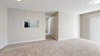 Located at 116 Northwoods Dr in Seneca, SC, this single-floor, 2-bedroom, 2-bathroom home offers a well-organized layout designed for comfortable everyday living. The open-concept living and dining area is finished with warm neutral-toned walls and plush carpet, creating an inviting atmosphere bathed in natural light. A bold dark front door serves as a striking entry point into the space. The kitchen connects seamlessly to the living area via a pass-through window, and features white shaker-style cabinetry, granite-look countertops, a stainless steel sink, dishwasher, and range, all set over wood-look flooring. The primary bedroom is generously sized, with carpet flooring, natural light, and direct access to a private bathroom equipped with a tub-shower combo and a vanity with white cabinetry. The second bedroom also offers carpet flooring, a window for natural light, and a closet with sliding panel doors. Four closets throughout the home provide ample storage, including a spacious walk-in closet with wire shelving. Both bathrooms are finished with wood-look tile flooring and tub-shower combinations. A dedicated laundry area with washer and dryer hookups adds everyday convenience, completing this functional and well-appointed home.