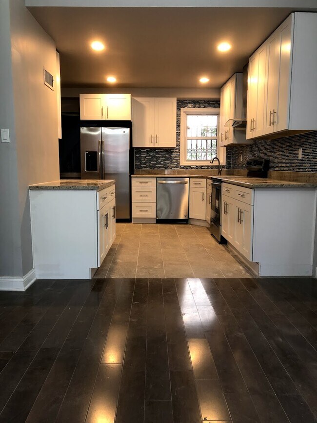 Contemporary White Kitchen, SS appliance Stone countertop - 419 S Carlisle St
