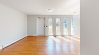 Located at 8 Wilsonview Ave in Guelph, Ontario, this well-appointed one-bedroom, one-bathroom unit offers a functional and comfortable single-floor layout. The living room is a standout feature, bathed in natural light streaming through a row of tall, narrow windows that frame views of the surrounding greenery. Warm hardwood flooring extends throughout the living and bedroom areas, creating a cohesive and inviting atmosphere. The bedroom is a cozy, private space with the same hardwood flooring and clean neutral walls, offering a calm retreat. The kitchen is efficiently designed with rich dark-toned cabinetry, light countertops, a decorative tile backsplash with mosaic accent detailing, and a full suite of stainless steel appliances including an electric range, built-in microwave, and dishwasher. Light tile flooring completes the kitchen's clean, modern look. The bathroom features a full soaker tub and shower combo with white tile surround, light tile flooring, and classic chrome fixtures, maintaining a clean and practical aesthetic throughout. The unit's thoughtful layout makes excellent use of its space, providing all essential rooms in a compact and efficient footprint ideal for comfortable everyday living.
