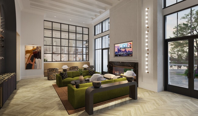 Expansive clubroom with fireplace, gathering space, and demonstration kitchen. - Modera Nations