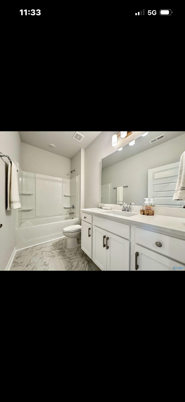 Building Photo - "NEWLY BUILT- Spacious 4-Bedroom Haven with Granite Elegance and Cozy Fireplace in Harvest"