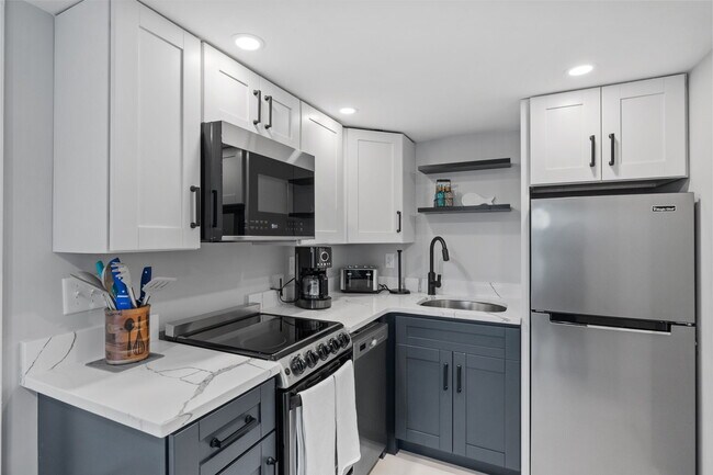 Kitchen has fridge/freezer, dishwasher, electric range, microwave, coffee maker, and toaster. - 17 Manchester St
