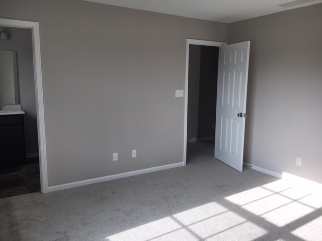 Master bedroom with en suite bathroom and walk in closet. - 2571 W 127th Pl