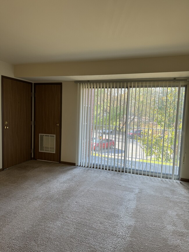 Living Room & Balcony - Oak Trails Apartments