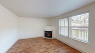 Located in Bend, Oregon, this single-floor, one-bedroom, two-bathroom residence offers a well-organized and functional layout. The living room serves as the heart of the home, featuring warm wood-look flooring, a tile-surround corner fireplace, and large windows that invite natural light while offering views of the surroundings. Adjacent to the living area, the combined kitchen and dining space is designed for efficiency. The galley-style kitchen is outfitted with light wood cabinetry, granite-look countertops, stainless steel appliances including a refrigerator, electric range, and dishwasher, and track lighting overhead. A dedicated dining area with wood-look flooring sits just beyond, brightened by a window. The bedroom is carpeted for comfort and includes generous closet space, with access to a walk-in closet as well as an additional closet. Two full bathrooms, each featuring a tub-shower combination with clean white surrounds, provide practical convenience. Additional highlights include a laundry area, multiple storage closets throughout, and a hallway connecting the rooms. The neutral color palette and consistent finishes create a cohesive, move-in-ready atmosphere throughout the home.