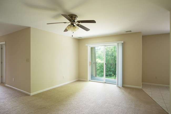 Living Area With Sliding Glass Door - Glenmont Manor