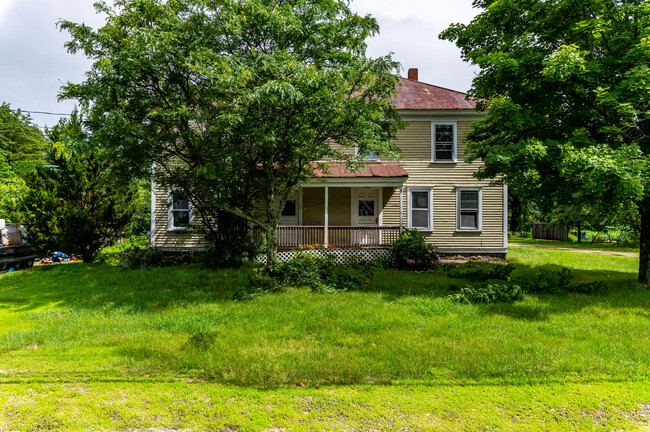 Front of the house; it'll get painted in 2024, and the roof will be treated too. - 1602 E Main St