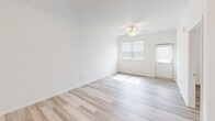 Located at 609 Grove Cir in Milton, Delaware, this well-appointed two-bedroom, two-bathroom home offers comfortable single-floor living with a clean, modern aesthetic. Light hardwood-style flooring flows throughout the entire home, complementing the bright white walls and creating a cohesive, airy atmosphere.

The kitchen serves as a standout feature, boasting rich dark-stained cabinetry, granite countertops, and a full suite of stainless steel appliances including a refrigerator, range, and built-in microwave. A peninsula with pendant lighting provides additional counter space and casual seating, opening seamlessly toward the living area.

Both bedrooms are well-sized, filled with natural light from windows fitted with blinds, and each equipped with ceiling fans. The primary bedroom offers a generous footprint with its own dedicated bathroom featuring a walk-in glass-door shower, dark wood vanity, and granite countertop. The second bathroom includes a tub-shower combination and matching granite vanity cabinetry.

A dedicated laundry room houses a full-size top-loading washer and dryer with additional shelving. The home also includes two closets for ample storage. A covered pergola visible from the exterior adds outdoor living potential to this move-in-ready Milton residence.