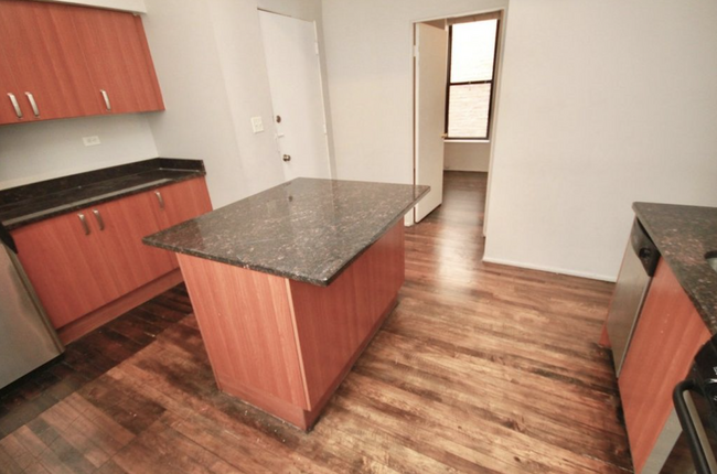 Tons of cabinet space and rich flooring - 2824 N Orchard