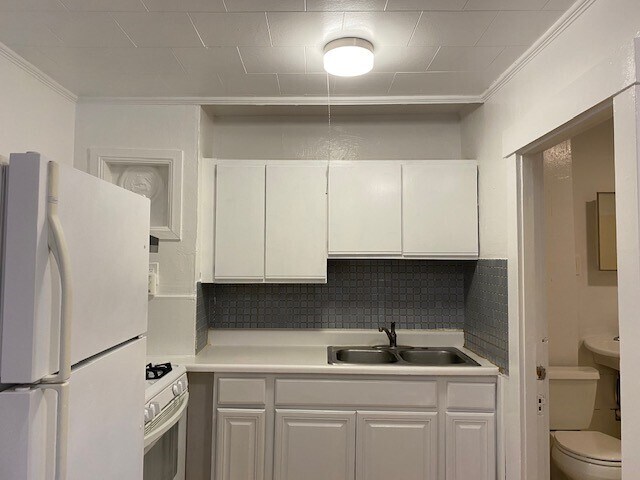 Kitchen with blue tiled backsplash &amp; Freshly Painted Cabinets/Walls/Ceiling - 184 Hall Street