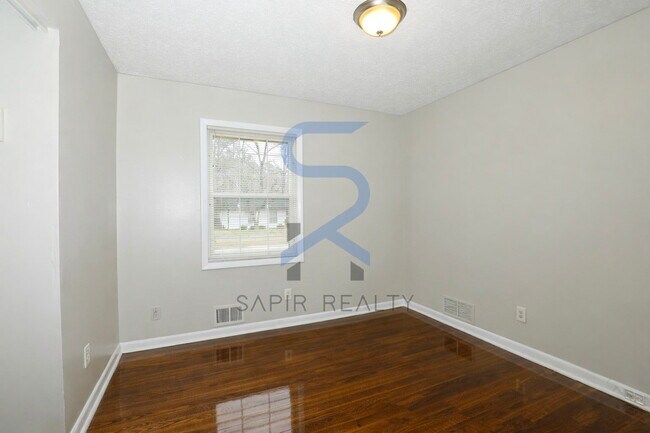 Building Photo - Timeless All-Electric Ranch Charm in a Vibrant, Peaceful Corner of South River Gardens