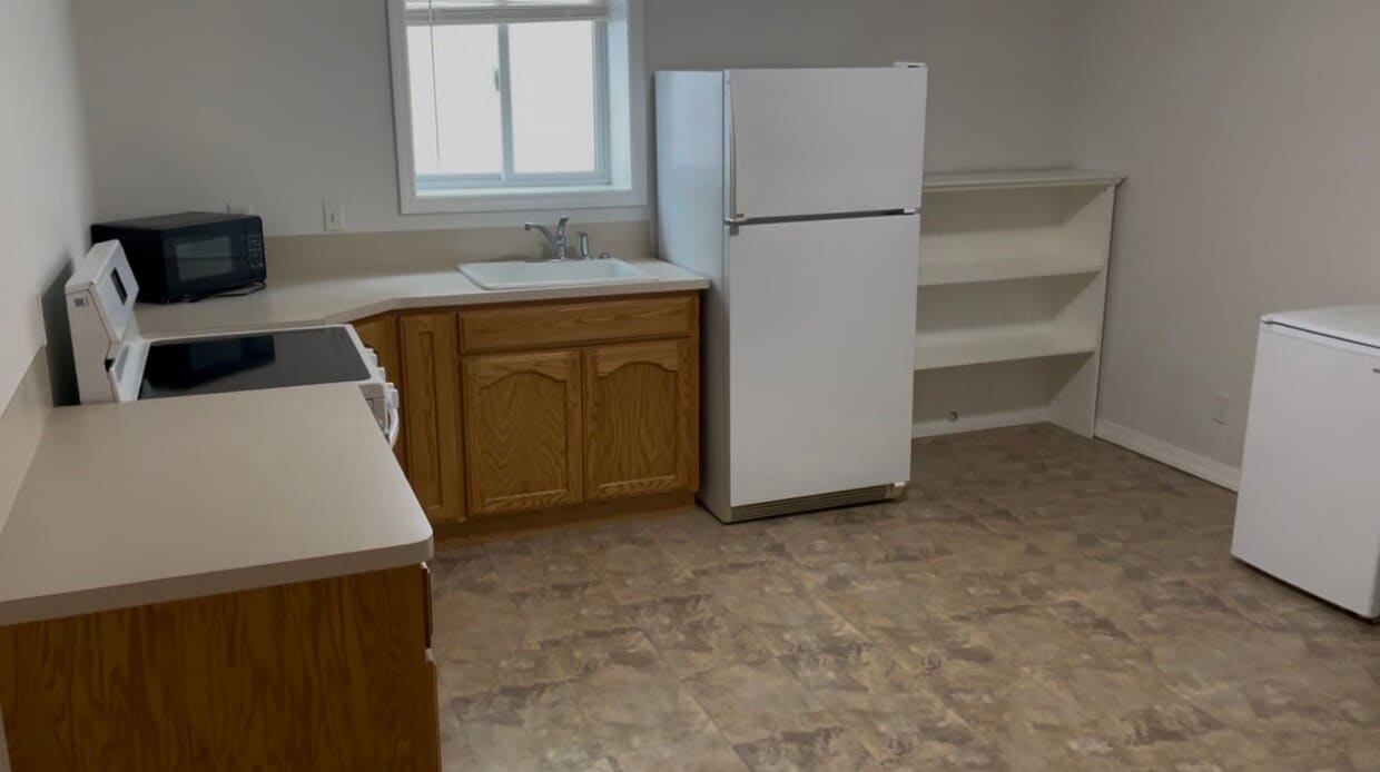 Large kitchen with range, refrigerator and microwave. - 164 Rosewood Dr