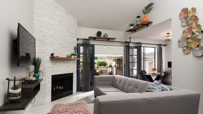Vaulted ceilings, French doors, and light-drenched living room. - 5655 Riley St