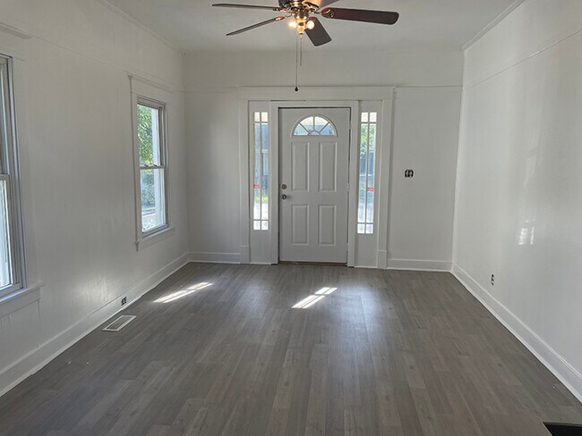 View from dining room looking at living room and front door - 1107 Central Ave