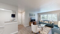 Located at 3911 Steam Mill Rd in Columbus, Georgia, this single-story, 3-bedroom, 2-bathroom home offers a thoughtfully designed layout with modern finishes throughout. The open-concept living and dining area is bright and welcoming, featuring light wood-look flooring, neutral wall tones, and large windows with blinds that invite natural light. The living room provides generous space for seating and entertainment, flowing seamlessly into the dining area, which comfortably accommodates a full dining set beneath a flush ceiling light.

The kitchen is well-equipped with white shaker-style cabinetry, granite-look countertops, a classic white subway tile backsplash, a stainless steel sink, and black appliances — combining style with practicality. A dedicated laundry area and utility room add everyday convenience.

The primary bedroom is a comfortable retreat, featuring plush carpeting, a ceiling fan with light, and a window that brings in natural light. The additional bedrooms are equally well-sized with carpet flooring and natural light. Three closets provide ample storage throughout the home.

Both bathrooms are finished with white vanity cabinetry, granite-look countertops, framed mirrors, and tiled tub-shower combinations. The overall aesthetic is clean, modern, and move-in ready — making this home a practical and attractive option in Columbus, GA.