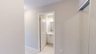 Located at 1020 Paisley Rd in Guelph, Ontario, this thoughtfully designed 2-bedroom unit offers a comfortable and functional single-floor layout. The interior is finished with light-toned laminate hardwood flooring throughout the living and bedroom areas, complemented by neutral warm-beige walls that create a clean, modern aesthetic. The open-concept kitchen features a breakfast bar peninsula with pendant lighting overhead, warm countertops, white cabinetry, and stainless steel appliances, flowing seamlessly into the living area. The generously sized primary bedroom includes access to a private ensuite bathroom and a dedicated walk-in closet equipped with wire shelving along two walls for ample storage. The second bedroom is bright and inviting, with large sliding windows that frame views of the surrounding Guelph streetscape and treetops. A dedicated in-suite laundry room provides added convenience, complete with built-in shelving and washer-dryer hookups. The private balcony, framed by glass and metal railings, offers elevated, open views of the city neighbourhood. Throughout the unit, clean white trim, smooth ceilings, and abundant natural light contribute to a bright, contemporary living environment.