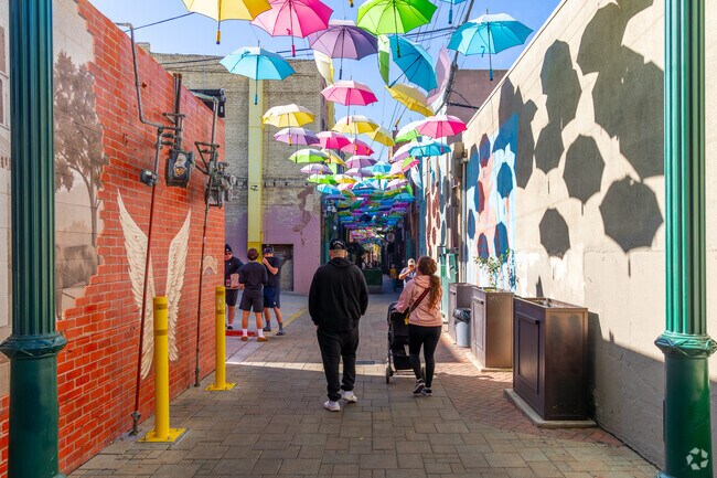 Walk under the colorful umbrellas in Orange Street Alley in Downtown Redlands.