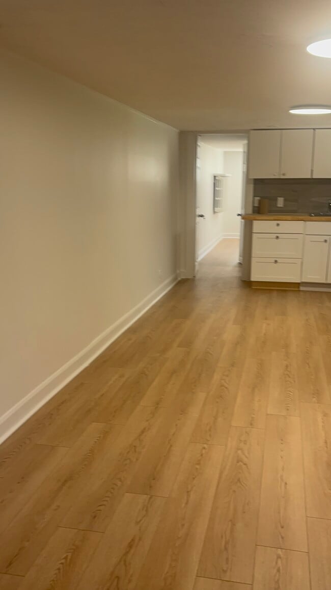 Living room leading to kitchen - 8 White Pine Av