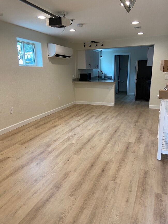 Living Room / Kitchen Eat In Area - 3583 S Bannock St Apartments