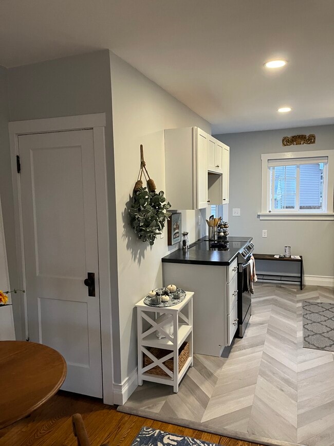 Kitchen with south and west facing windows. Stainless appliances. - 701 20th St S