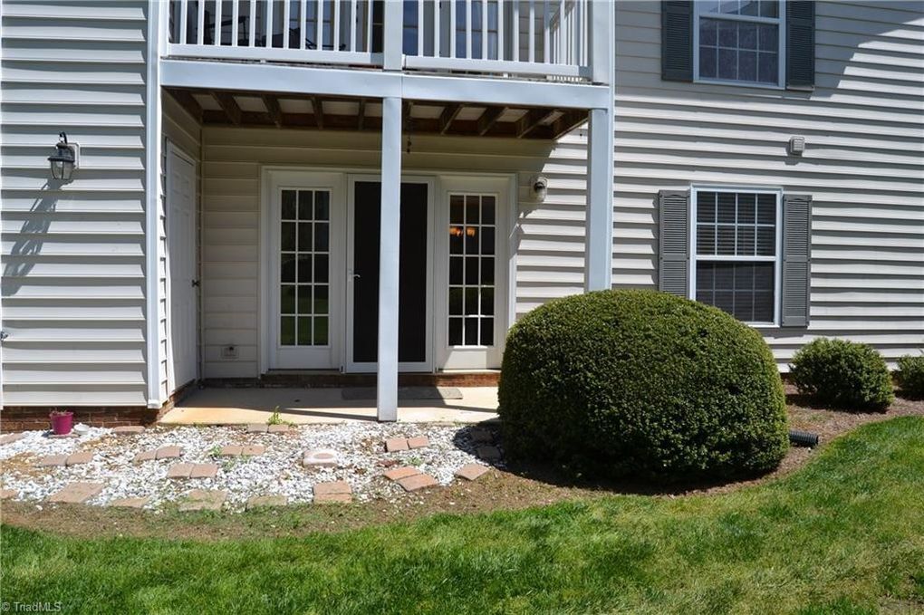 outdoor patio and back lawn away from parking log. - 7123 W Friendly Ave