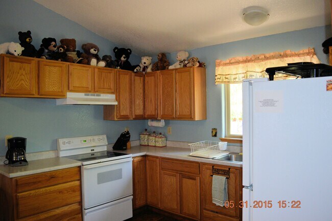 Kitchen. Includes coffee maker, microwave, toaster oven, dishes, pans, silverware, cooking utensils. - 24771 Amber Drive