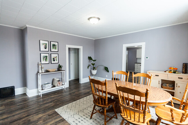 Dining Room towards rear of house, doors lead to kitchen and hallway to 2 bd & 1 bath - 820 N Washington Ave