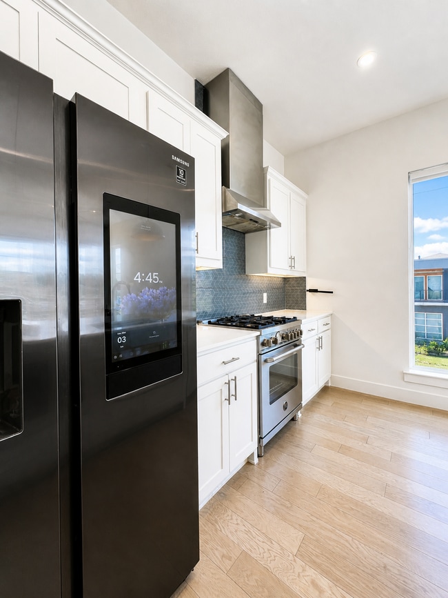 Kitchen with Samsung Smart fridge, Italian Stainless steel appliances and big windows - 5605 Bryan Pky