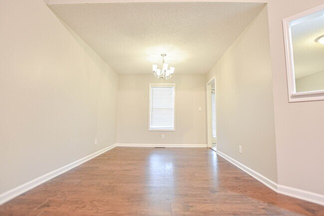 Building Photo - Pet Friendly Three Bedroom with Bonus!