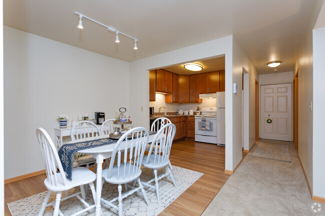 Open-concept kitchen and dining areas - Apple Valley Apartments and Townhomes