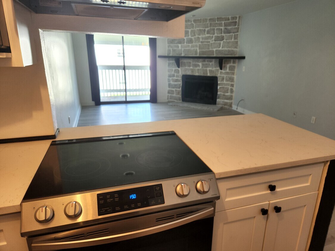 Wood floors, electric fireplace - 14161 E Jewell Ave
